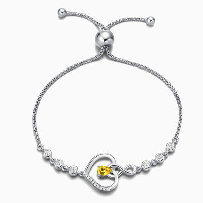 December Birthstone Inlaid Heart Wrapped Silver Bracelet
