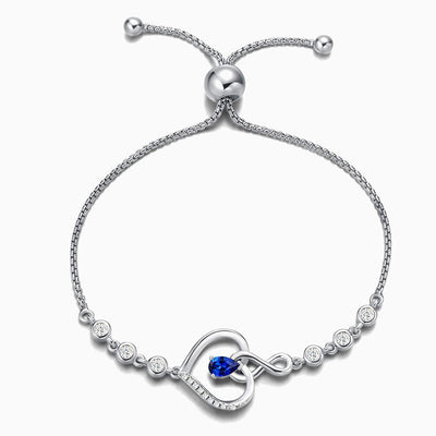 December Birthstone Inlaid Heart Wrapped Silver Bracelet
